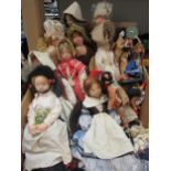 A collection of mostly cloth character dolls