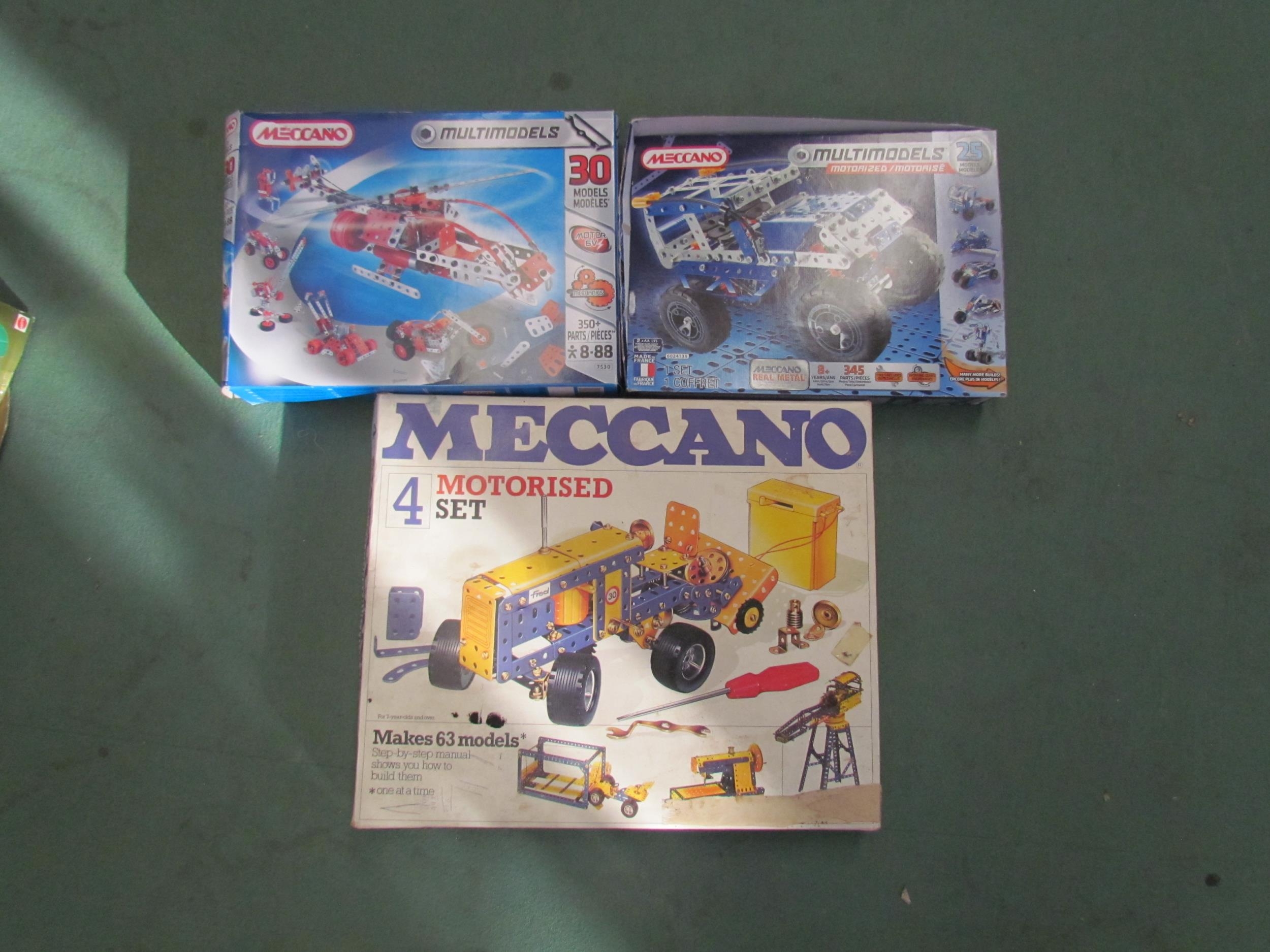 A Meccano Motorized Set 4 together with two Meccano Multimodel sets (3)