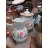 A ceramic lidded twin handle pot and wash jug rose transfer pattern