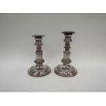 A pair of Sheffield plate on copper candlesticks, gadrooned detail