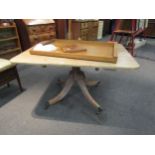 A 19th Century mahogany dining table, the round-cornered top upon a pedestal to quatre form reeded