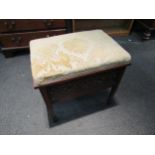 A late Victorian walnut dressing table stool with upholstered top over fretwork sides, square