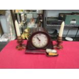 A bakelite Ingersol mantle clock, a pair of bakelite candlesticks of squat form and two cheroot