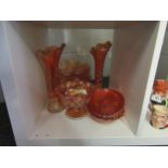 Nine pieces of orange carnival glass including two vases, dishes, bowls and jug