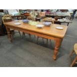 An Earsham Hall pine kitchen table, turned legs, 78cm high x 198cm long x 90cm wide