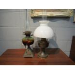 Two oil lamps, one with brass base
