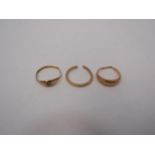 Two 18ct gold rings, worn/ split, 5.7g and a 22ct gold ring bent/ set with a single diamond, 2g