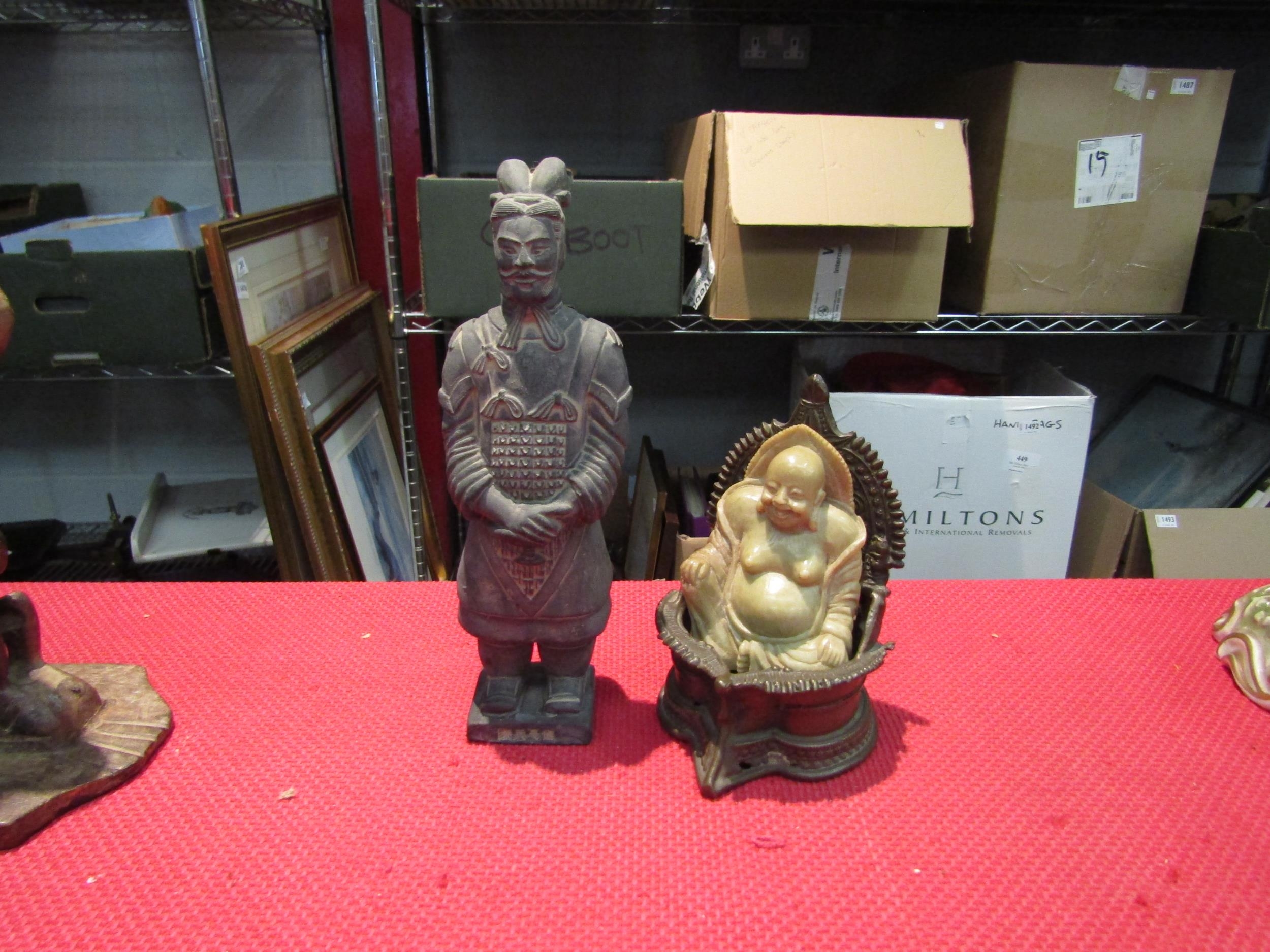 A seated Buddha on cast metal elaborate seat and a reproduction terracotta army figure (2)