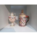 Two pieces of Capodimonte: a highly decorated cup and cover with lion finial and elephant handle and