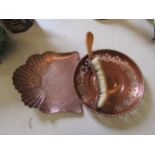 Two early 20th Century copper trays, one pierced with leaf design, plus a copper covered wooden