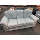 A classic style three-seater sofa, rope trim, loose cushions, pale blue floral upholstery, Life