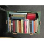 A box of books on travel, the Middle East, the Far East, etc., including Freya Stark, Lawrence