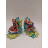 A pair of Italian pottery floral bookends, 14cm high, a/f