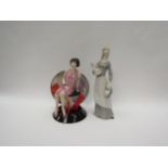A Kevin Francis ceramics Young Clarice Cliff "Trilogy" ceramic figure with a Lladro style figure