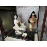 Two cased Japanese Gofum dolls - a musician and attendant, a/f