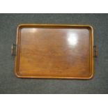 An early 20th Century oak drinks tray with twin handles, 63cm long