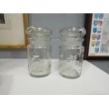 A pair of Edwardian cut glass jars, 15cm tall