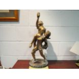 A gilded spelter Crosa classical Roman sculpture on a plinth, of an athlete raising a woman in his