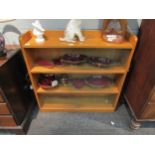 A 1960s oak bookcase with three sliding glass doors, 83cm high x 91cm wide x 22cm deep