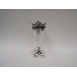 A silver vase with decorative fluted pierced rim, 17.25cm high, Birmingham