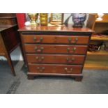 A George III mahogany chest of four long drawers, brass swan neck handles, bracket feet, some