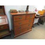 A circa 1900 walnut chest of two short over three long drawers, lined detail to drawer fronts,