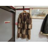 A 1960's early 70's zig zag cut fur coat with wood and brass buttons, Derbers label, front hem a/f