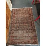An Afghan kilim rug with red ground and multiple rows of guls, 178cm x 110cm, tasselled fringe.