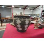 A Doulton Lambeth, Doulton & Slaters patent, pottery jardiniere with white floral applied design,