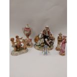 A group of continental figures, figural groups and a porcelain two handled urn on plinth, various
