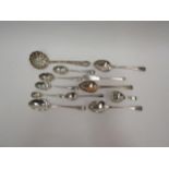 A quantity of silver spoons including sifting spoon, teaspoons etc (12)