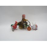 A clockwork tinplate delivery boy on bicycle, together with a tinplate Jumping Rabbit and Pecking