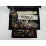 A box of costume jewellery including costume brooches, necklaces, earrings, bracelets etc