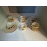 A Royal Worcester G & Co. miniature part teaset decorated with birds in flight a/f