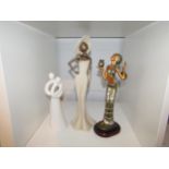 A figure of an African lady, Devotion figure and a modern stylistic figurine
