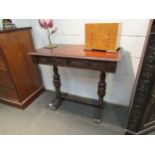 A Maltese mahogany side table, foliate carved throughout, single frieze drawer, cup and cover