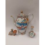 An Oriental coffee pot with character marks to base together with a figure of a dog and a