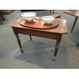 A 19th Century oak country hall table with round cornered top over plain frieze to turned