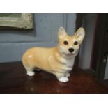 A Winstanley figure of a Corgi with glass eyes, No. 4 to base, 21.5cm