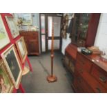 A wooden standard lamp