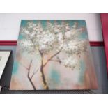 A print on canvas depicting a bright teal green sky with a white blossom tree and two birds, 80cm