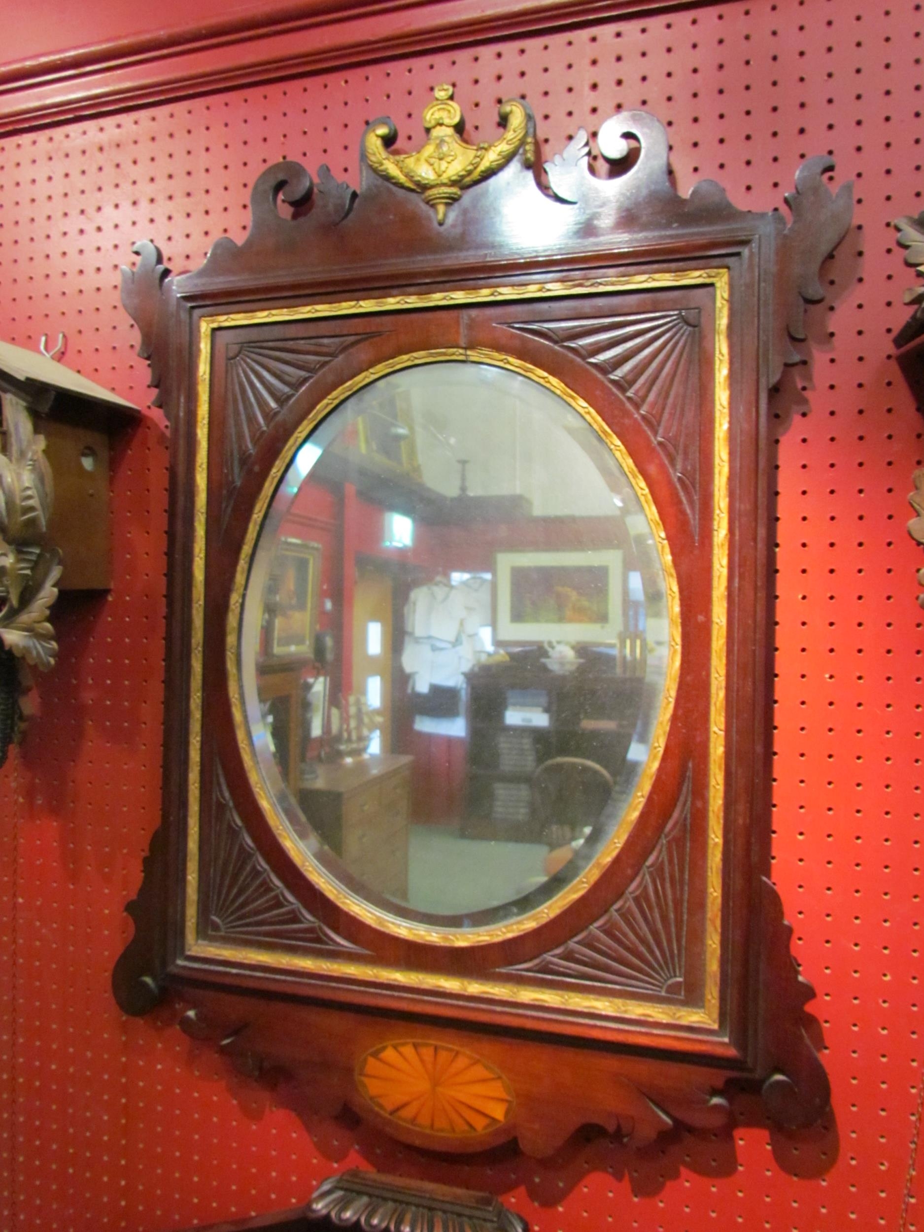A mahogany pier mirror, painted gilt Regency style motif and inlay, 83cm x 58cm total