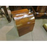 A 19th Century flame mahogany dome top box the hinged lid opening to reveal a velvet lined interior,