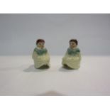 A pair of rocking girl miniature porcelain tapersticks, 5cm tall