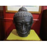 A cast metal Buddha head, 32cm