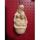 A religious holy water wall pocket, 18cm high