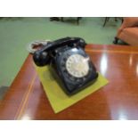 A 1970's vintage black dial telephone