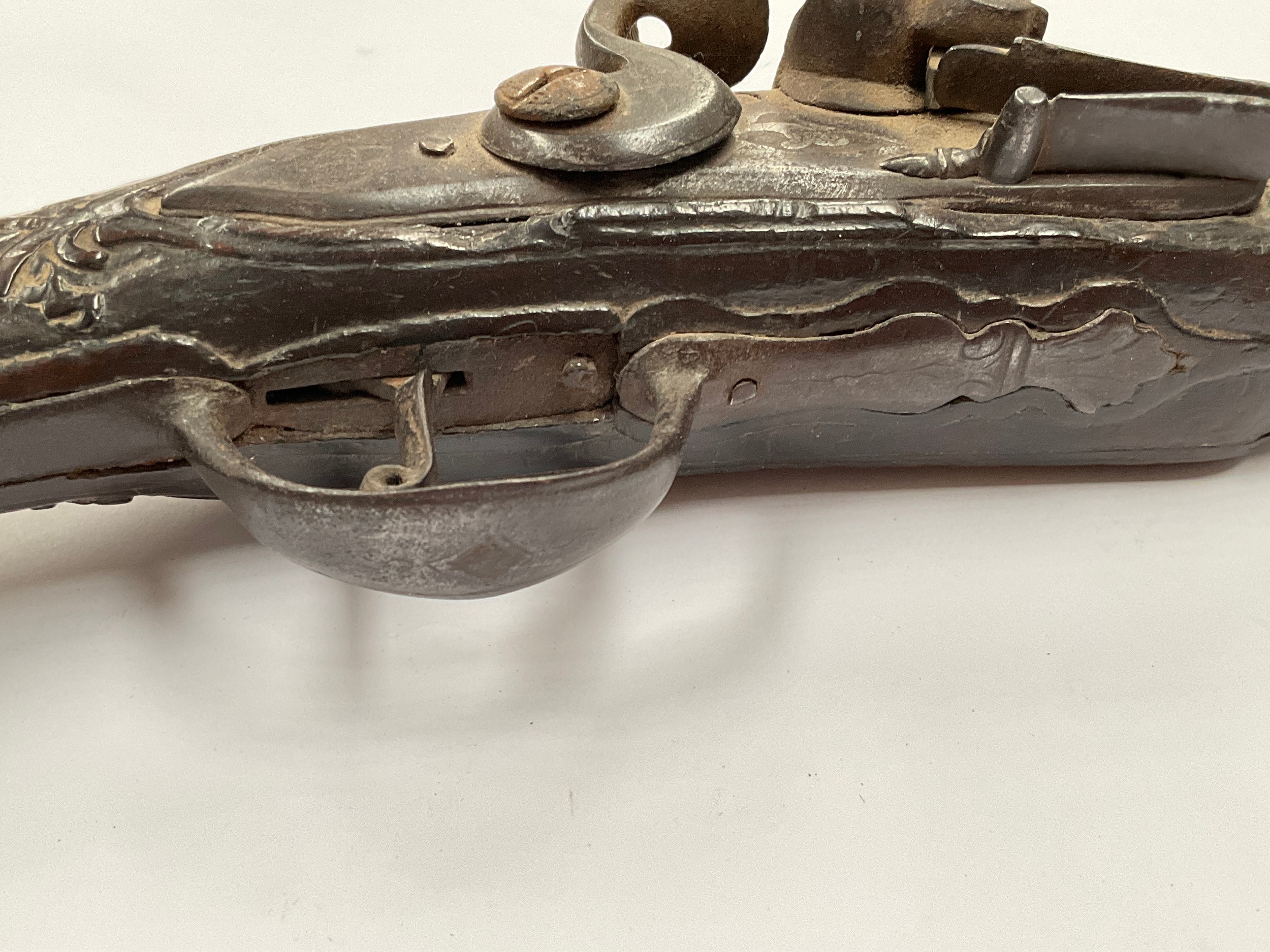 A late 18th Century flintlock pistol with all over scrolled foliate carving, part of mechanism - Image 3 of 6