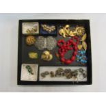 A tray of costume jewellery including amber earings, Trifari brooch, Kingfisher brooch etc.