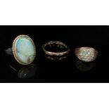 Two 9ct gold rings one set with clear stones, the other split and an 18ct gold ring with oval